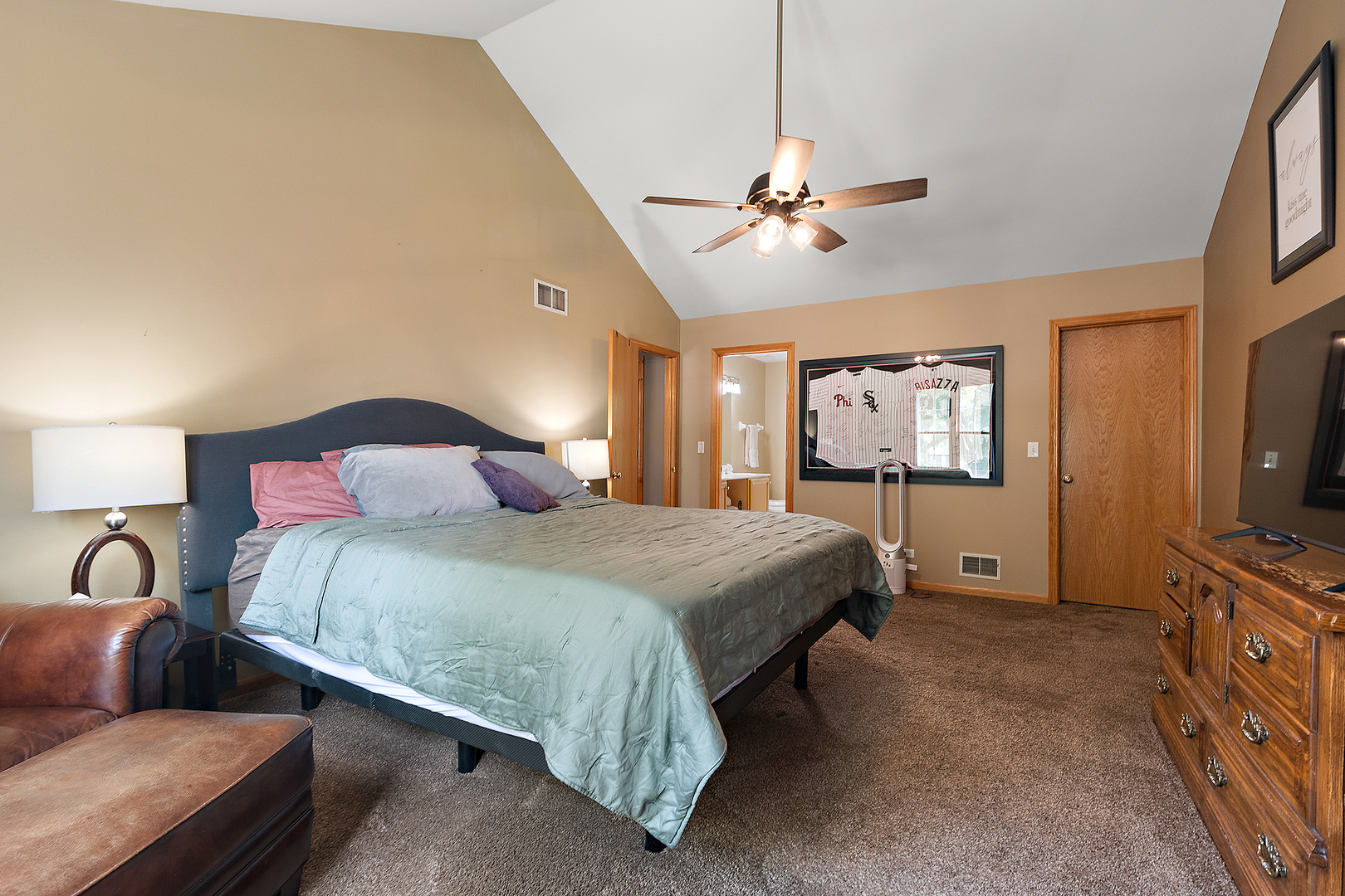 24929 Vermette Road Plainfield, IL 60585 - Photo 16 of 31 a bedroom with a bed and a flat screen tv