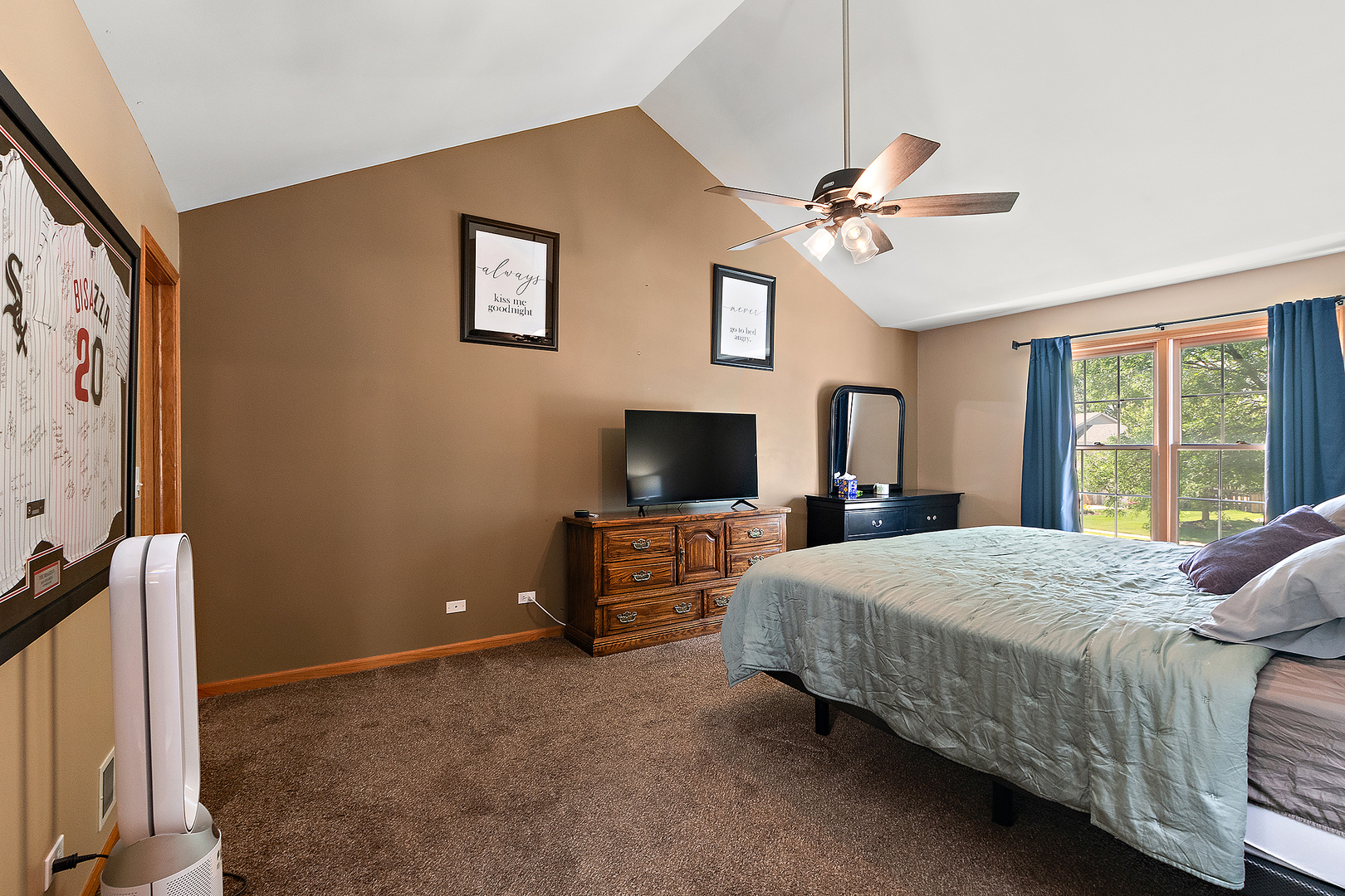 24929 Vermette Road Plainfield, IL 60585 - Photo 17 of 31 a bedroom with a bed and a flat screen tv