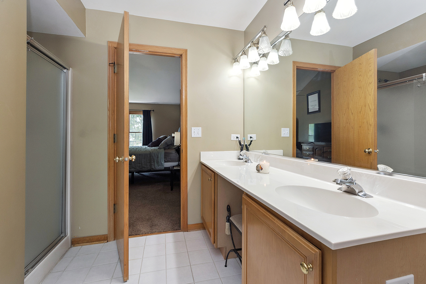 24929 Vermette Road Plainfield, IL 60585 - Photo 18 of 31 a en suite bathroom with a double vanity sink and a mirror