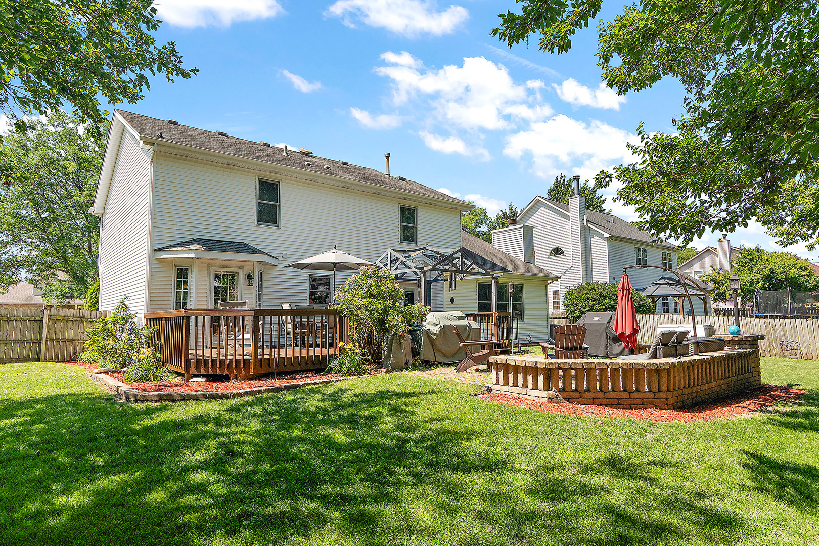 24929 Vermette Road Plainfield, IL 60585 - Photo 23 of 31 a front view of a house with a garden and deck