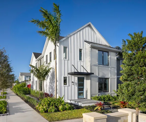 a front view of a house with yard