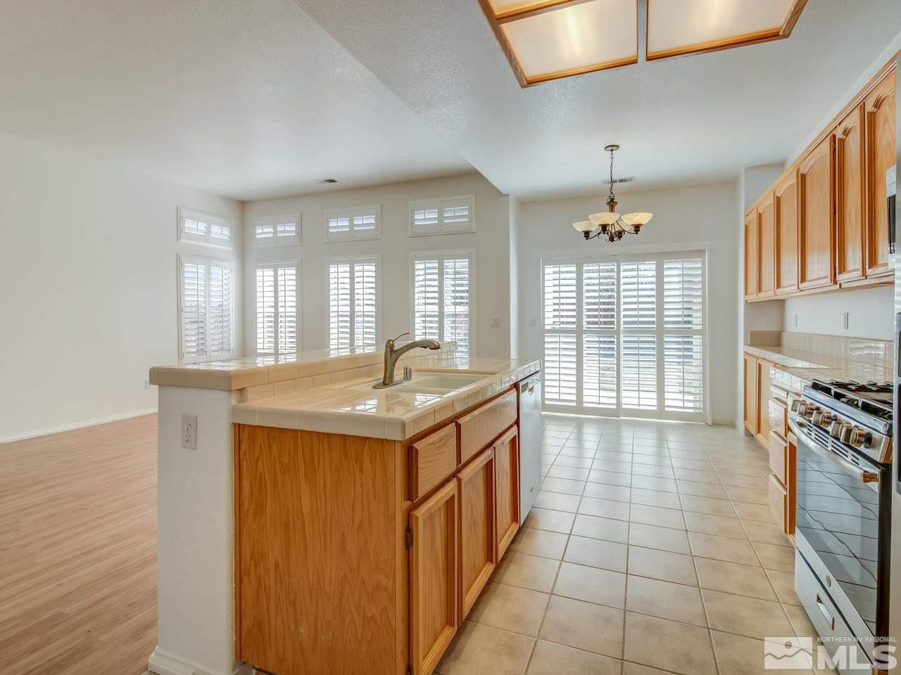 9350 Oakley Court Reno, NV 89521 - Photo 8 of 19 a kitchen with a stove and a sink