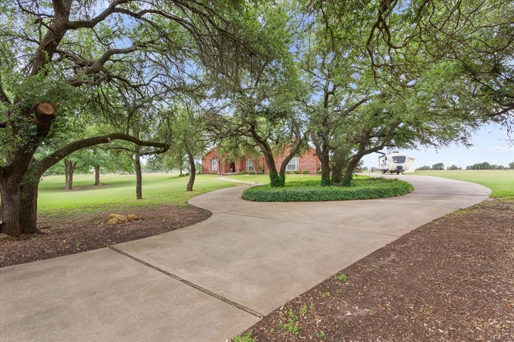 6008 Mesquite Tree Court Waco, TX 76708 - Photo 2 of 39 Open back yard with garden plot
