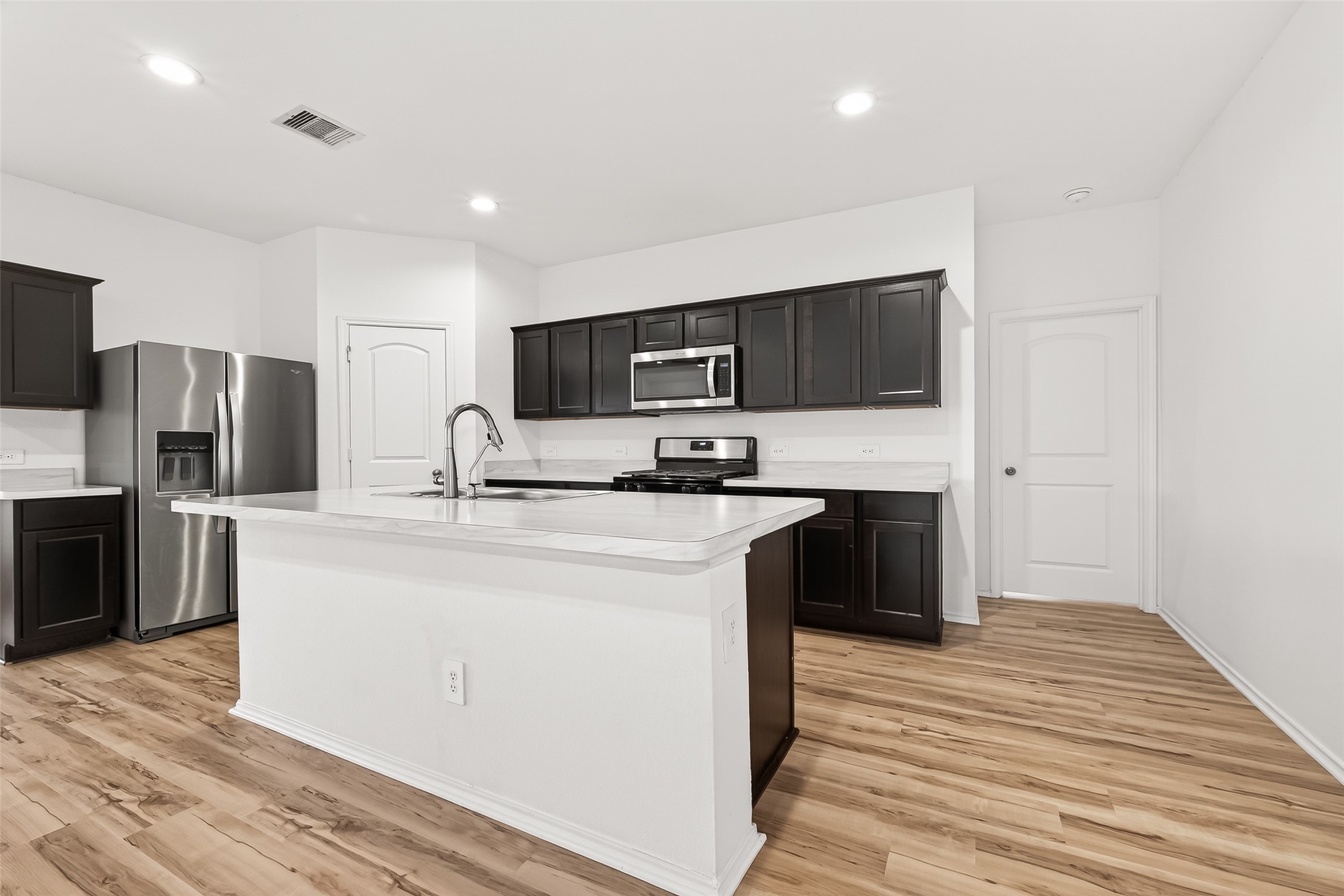 21522 Violet Ridge Road Katy, TX 77449 - Photo 12 of 39 Modern finishes and warm cabinets POP against your bright walls!