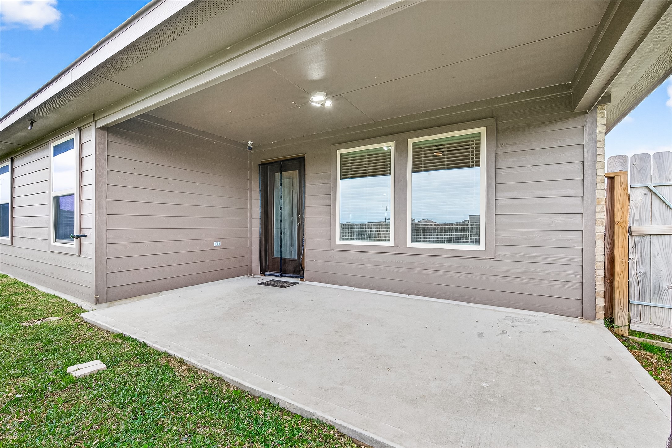 21522 Violet Ridge Road Katy, TX 77449 - Photo 34 of 39 HUGH covered patio to sit and enjoy a bar-b-que, the soothing sounds of a cool rain, a cigar, or friends!