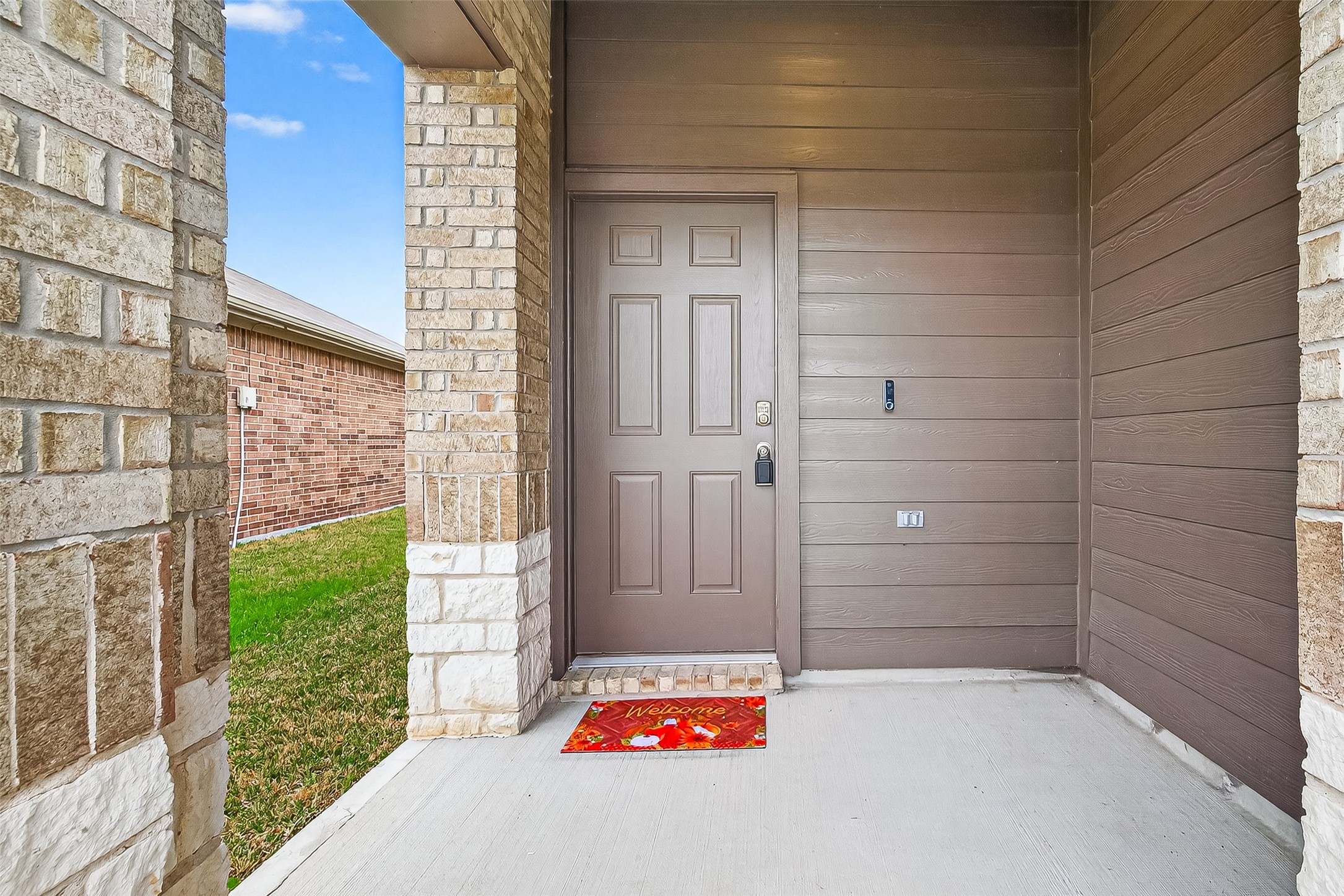 21522 Violet Ridge Road Katy, TX 77449 - Photo 5 of 39 Welcome to your inviting front porch, perfect for relaxing with a rocking chair and iced tea, offering a warm welcome to your new home.