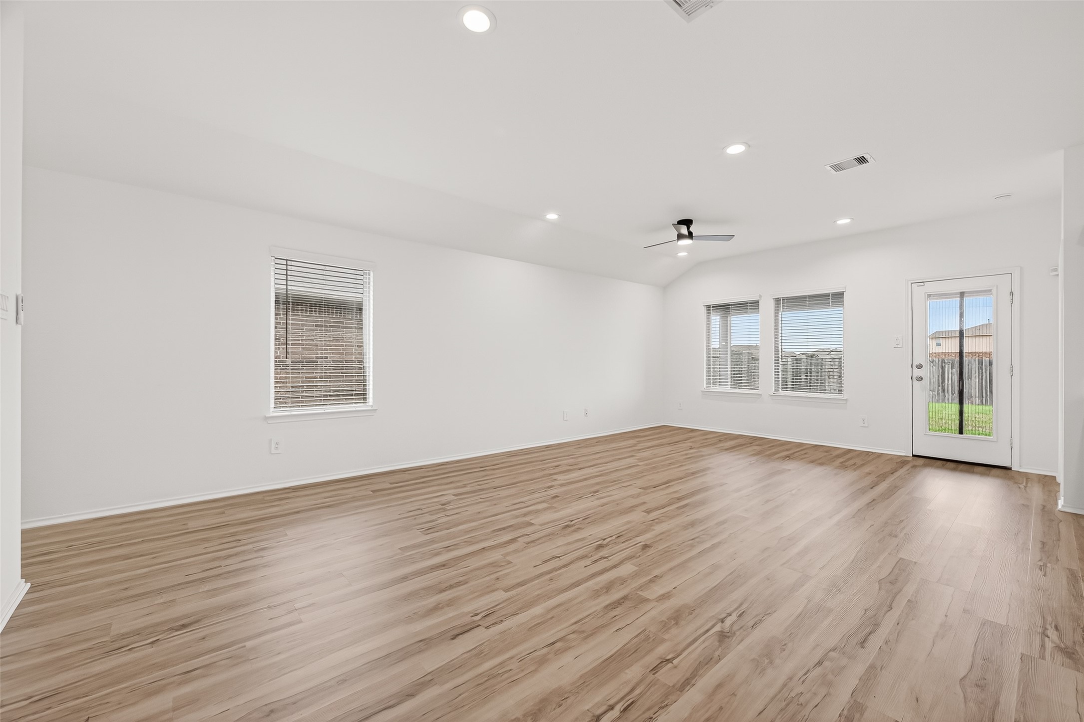 21522 Violet Ridge Road Katy, TX 77449 - Photo 8 of 39 Natural light pours into your family room for added warmth.