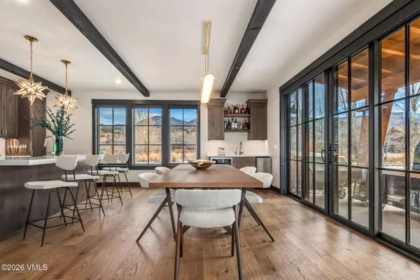 a view of a dining room with furniture window and wooden floor