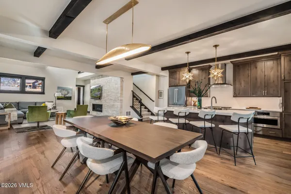 a view of a dining room with furniture and wooden floor