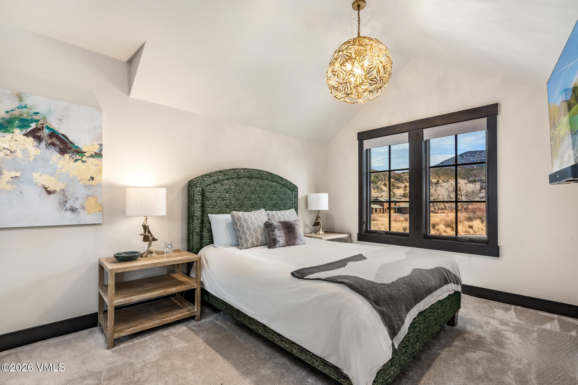 580 Hunters View Lane Eagle, CO 81631 - Photo 21 of 33 a bedroom with a bed and a window