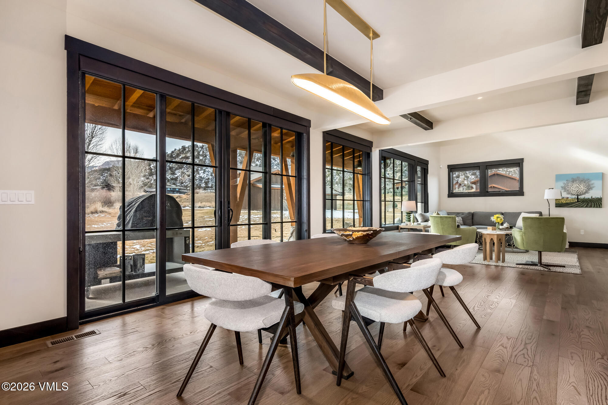 580 Hunters View Lane Eagle, CO 81631 - Photo 10 of 33 a view of a dining room with furniture window and wooden floor