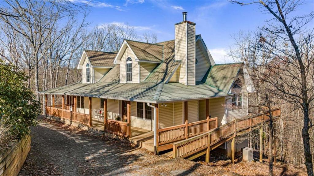 1410 Camp Branch Road Ellijay, GA 30540 - Photo 1 of 1 front view of a house with a yard