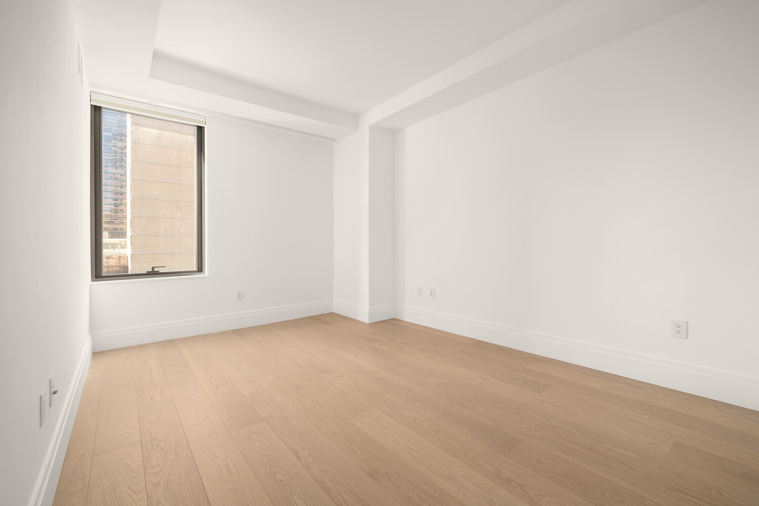 50 West 66th Street, Unit 9G Manhattan, NY 10023 - Photo 11 of 13 an empty room with windows