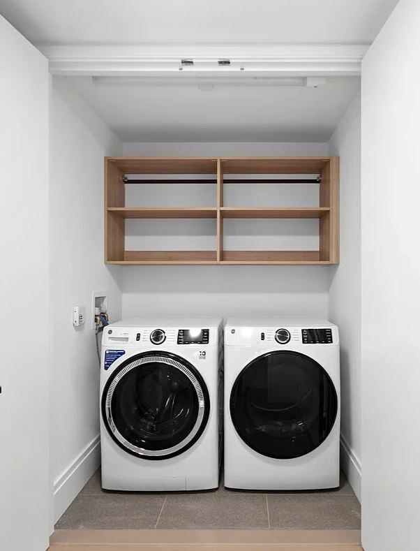 50 West 66th Street, Unit 9G Manhattan, NY 10023 - Photo 6 of 13 a utility room with dryer and washer
