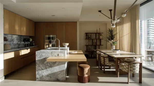 a dining table with chairs and window