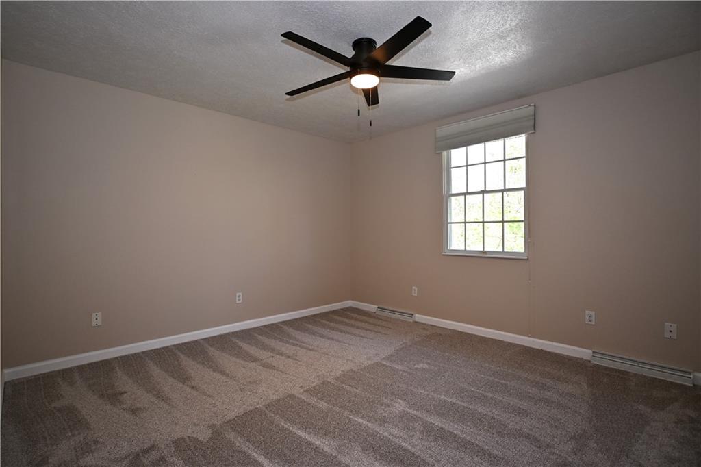 124 Valleycrest Drive Cecil, PA 15321 - Photo 15 of 38 wooden floor in an empty room with a window