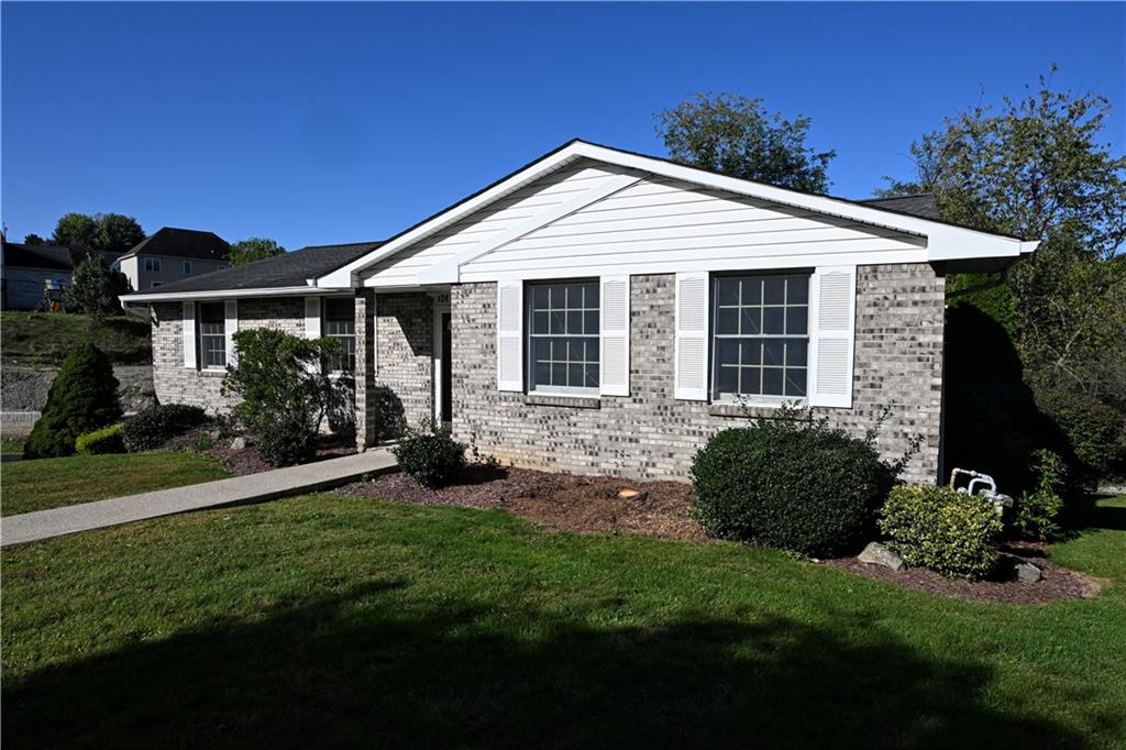 124 Valleycrest Drive Cecil, PA 15321 - Photo 2 of 38 a front view of a house with a yard