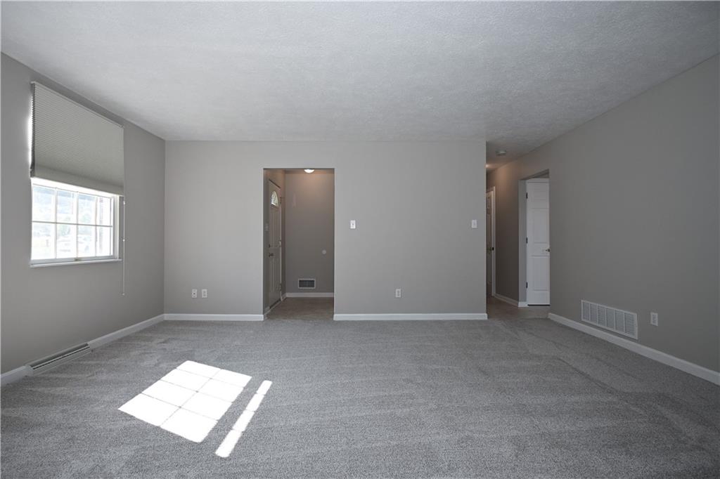 124 Valleycrest Drive Cecil, PA 15321 - Photo 4 of 38 an empty room with windows