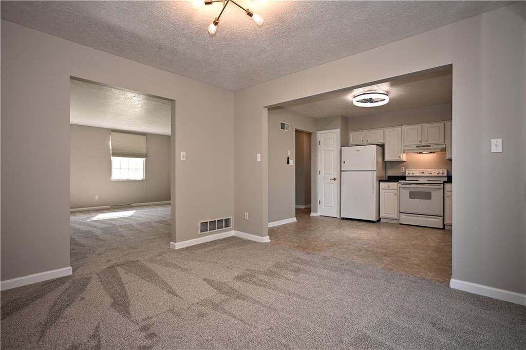 124 Valleycrest Drive Cecil, PA 15321 - Photo 9 of 38 an empty room with a kitchen and a sink