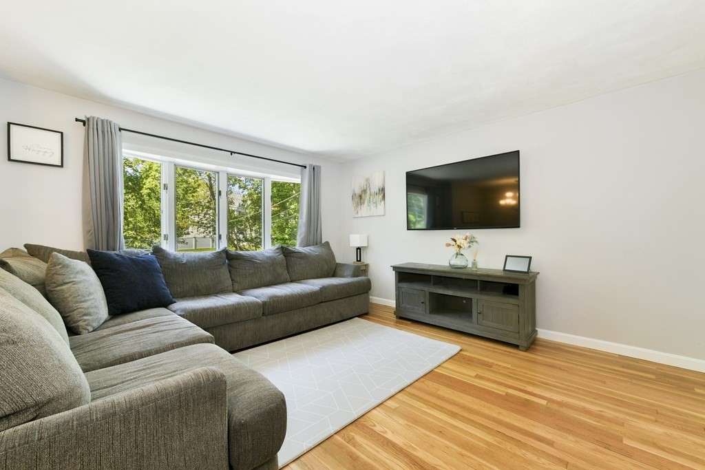 22 Allen Road Billerica, MA 01821 - Photo 6 of 25 a living room with furniture and a flat screen tv