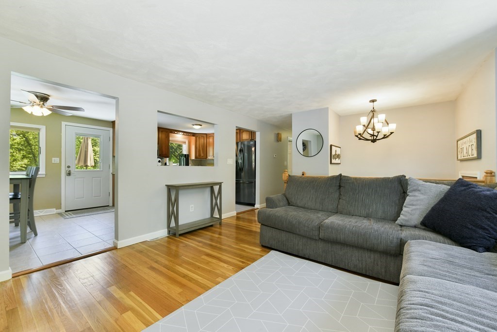 22 Allen Road Billerica, MA 01821 - Photo 8 of 25 a living room with furniture and a flat screen tv