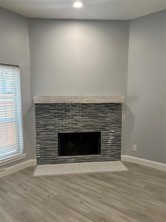 3121 Rosedale Avenue University Park, TX 75205 - Photo 6 of 16 Fireplace featuring a mosaic tile surround, built-in firebox, and a light-toned wood mantel. This modern look is what is planned for the renovations.