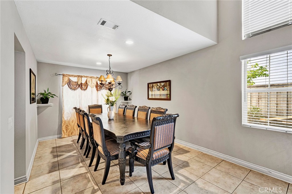 31755 Ridgeview Drive Lake Elsinore, CA 92532 - Photo 13 of 36 a view of a dining room with furniture and window
