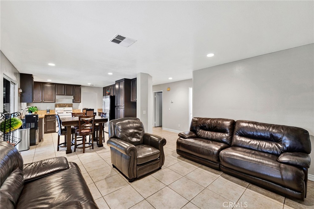 31755 Ridgeview Drive Lake Elsinore, CA 92532 - Photo 22 of 36 a living room with furniture kitchen view and a dining table