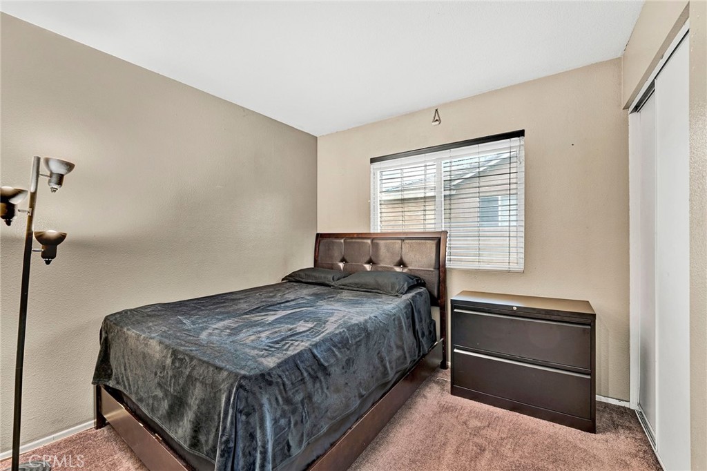 31755 Ridgeview Drive Lake Elsinore, CA 92532 - Photo 28 of 36 a bedroom with a bed and a window