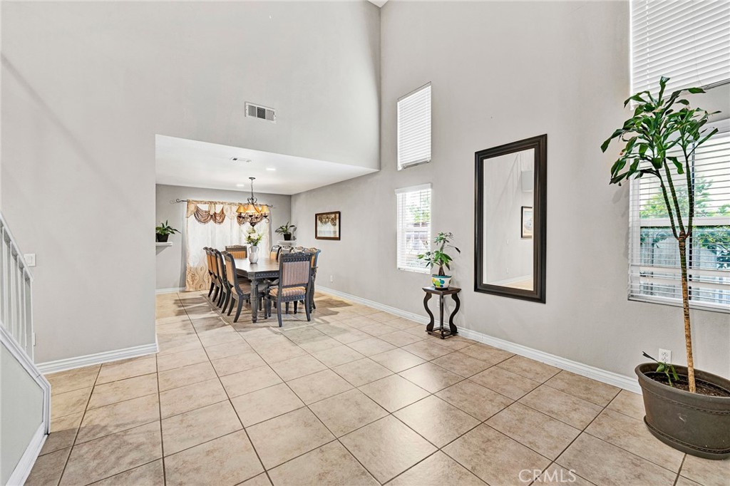 31755 Ridgeview Drive Lake Elsinore, CA 92532 - Photo 8 of 36 a dining room with furniture and a potted plant
