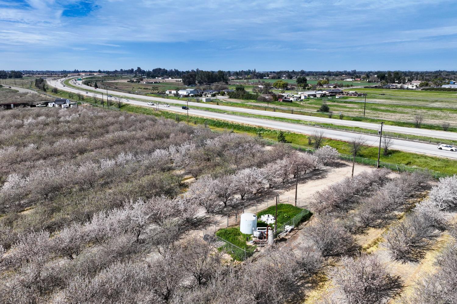 7581 East Kings Canyon Road Fresno, CA 93737 - Photo 5 of 12 a view of a yard with a lake view