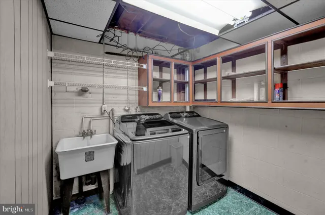 a utility room with a sink and a stove