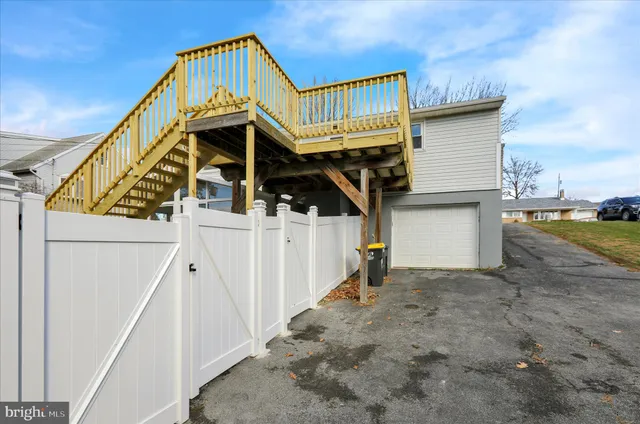 a view of a house with wooden stairs