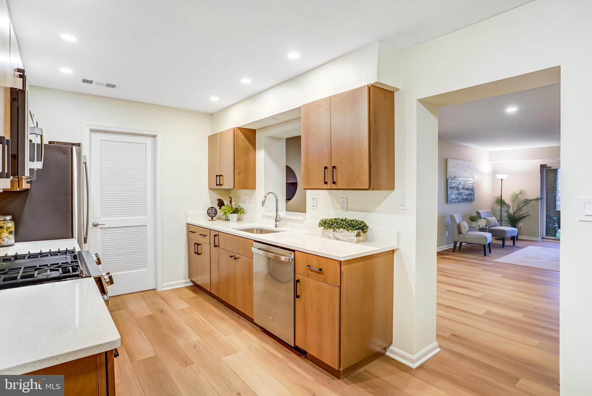 5825 Cove Landing Road, Unit 101 Burke, VA 22015 - Photo 14 of 30 Kitchen opens to laundry room .