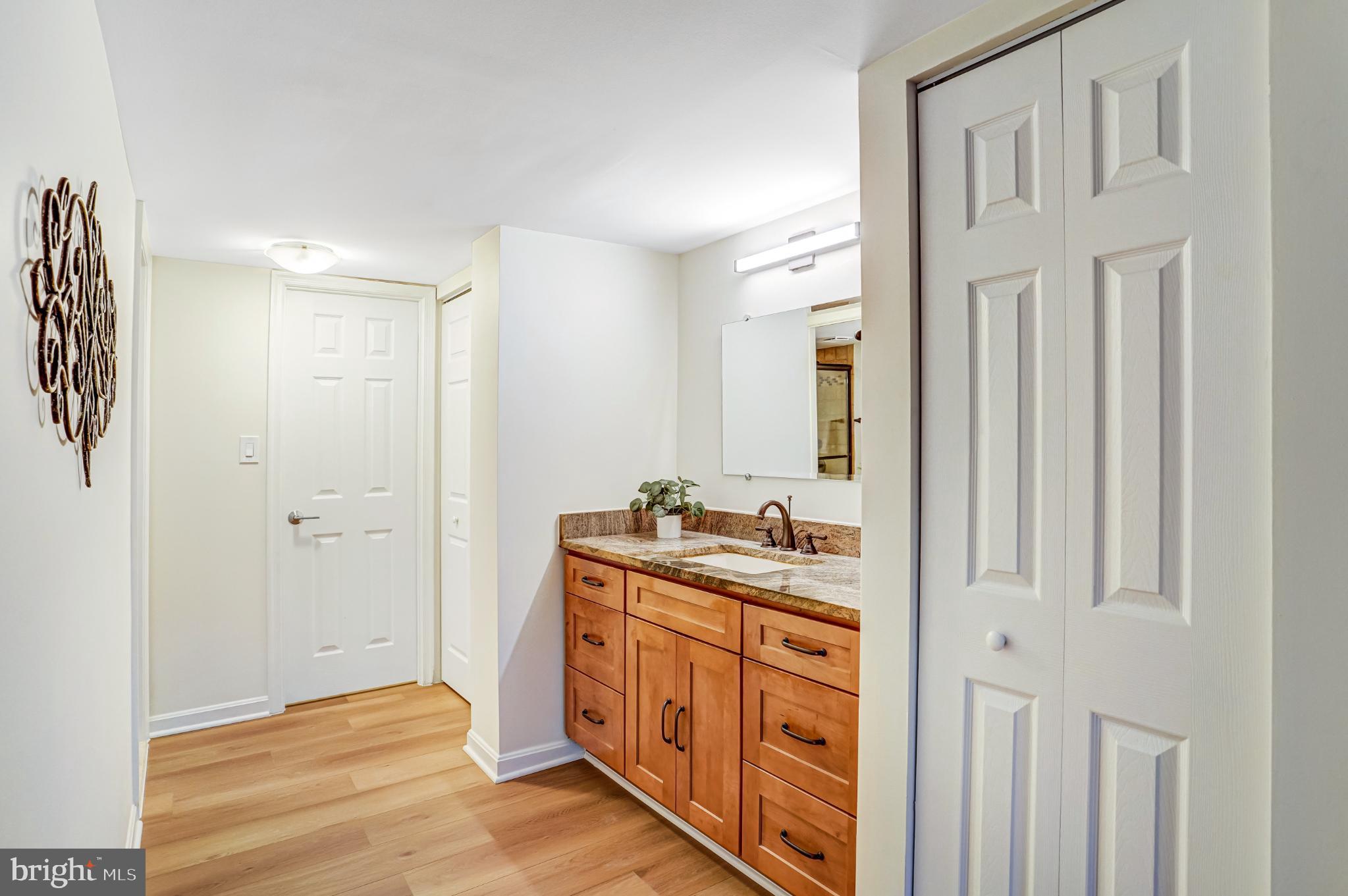 5825 Cove Landing Road, Unit 101 Burke, VA 22015 - Photo 17 of 30 Bright and inviting bathroom with modern finishes.