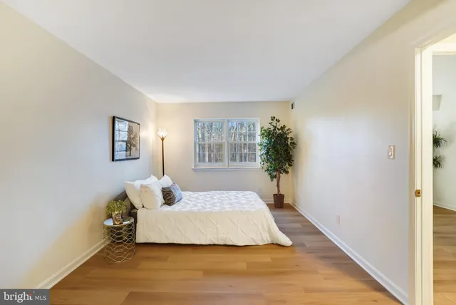 a bed room with a bed and a window