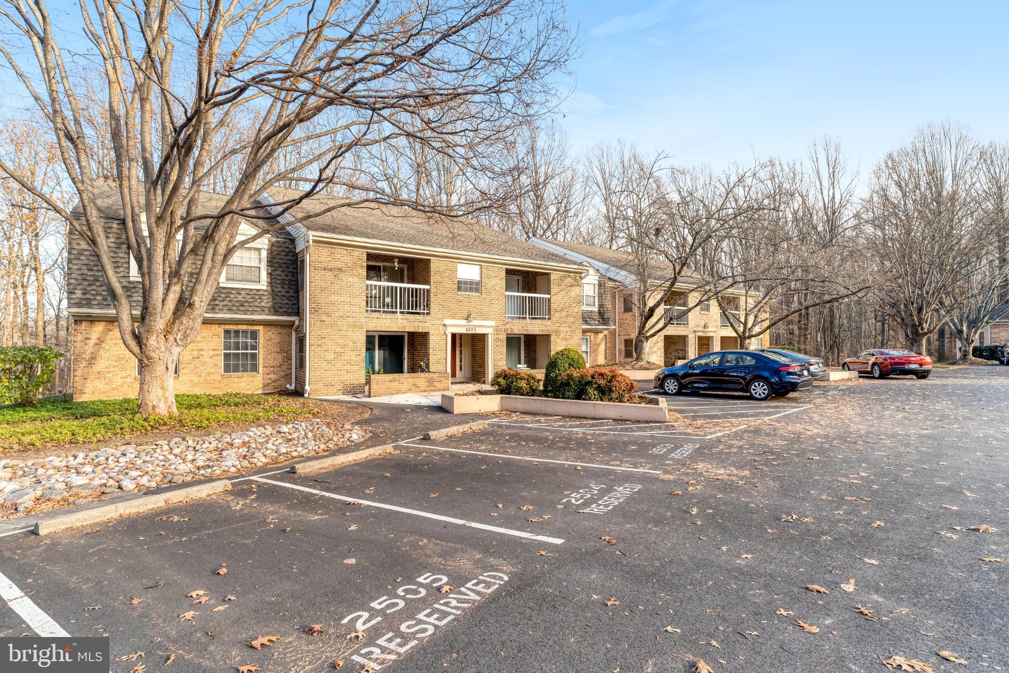 5825 Cove Landing Road, Unit 101 Burke, VA 22015 - Photo 2 of 30 Charming brick apartments amid serene trees.