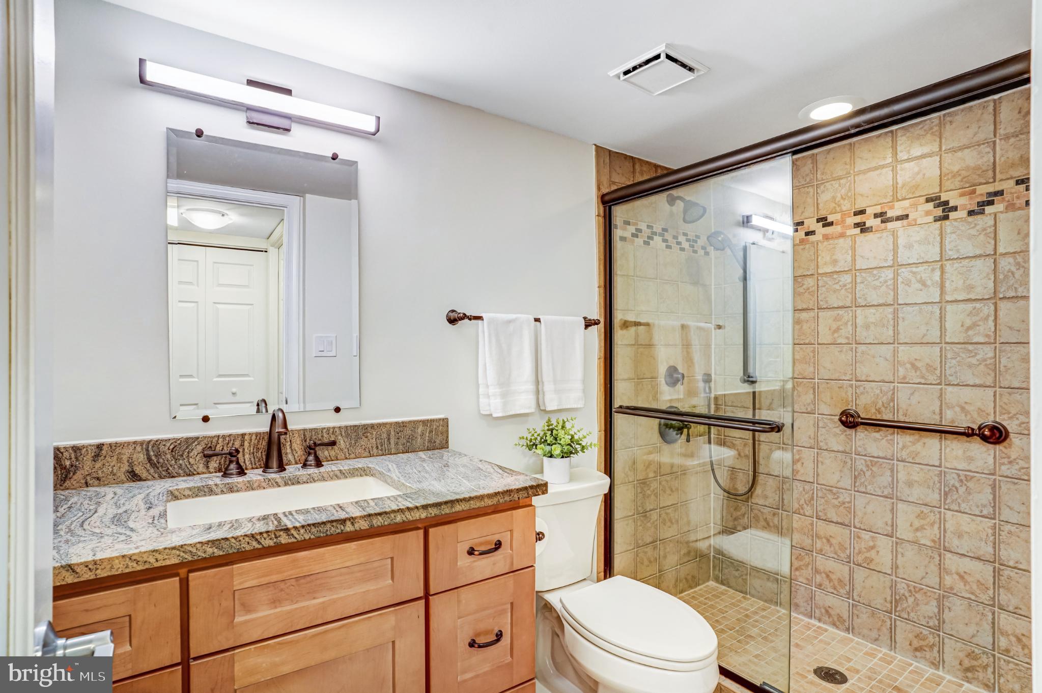 5825 Cove Landing Road, Unit 101 Burke, VA 22015 - Photo 21 of 30 Elegant bathroom with modern finishes.