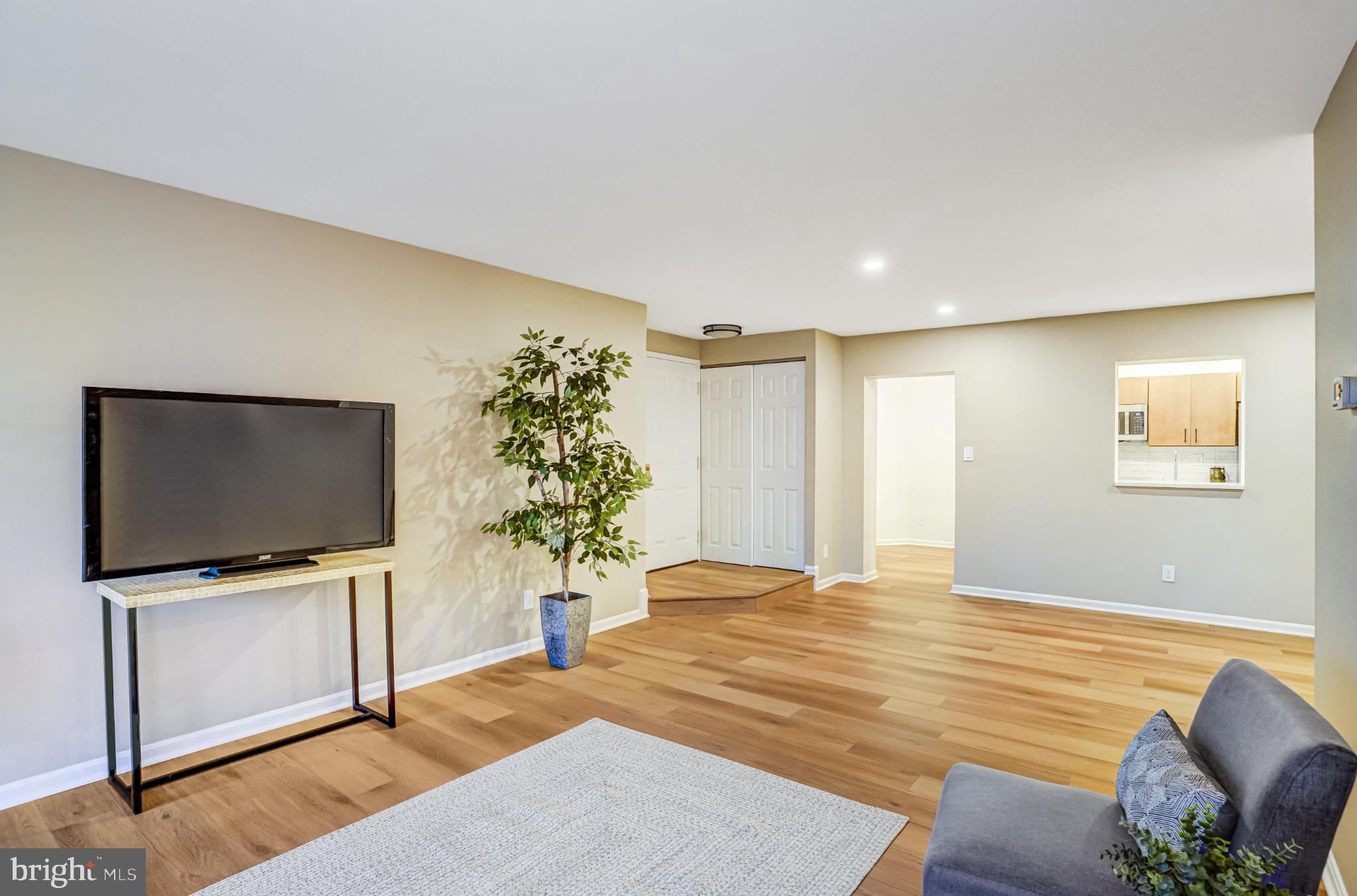 5825 Cove Landing Road, Unit 101 Burke, VA 22015 - Photo 7 of 30 Spacious living area with modern charm.