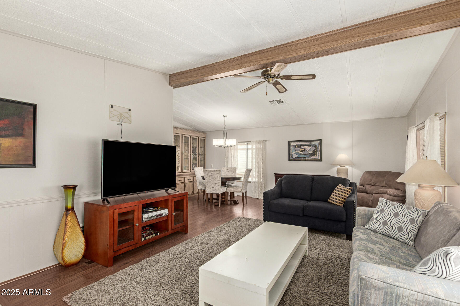 301 South Signal Butte Road, Unit 706 Apache Junction, AZ 85120 - Photo 16 of 51 a living room with furniture and a flat screen tv