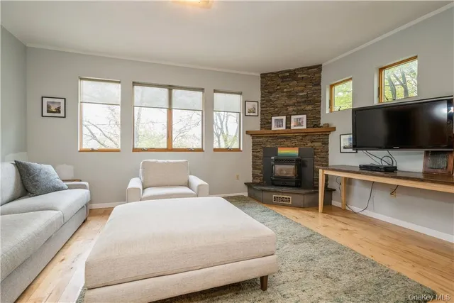 a bedroom with a bed and a television