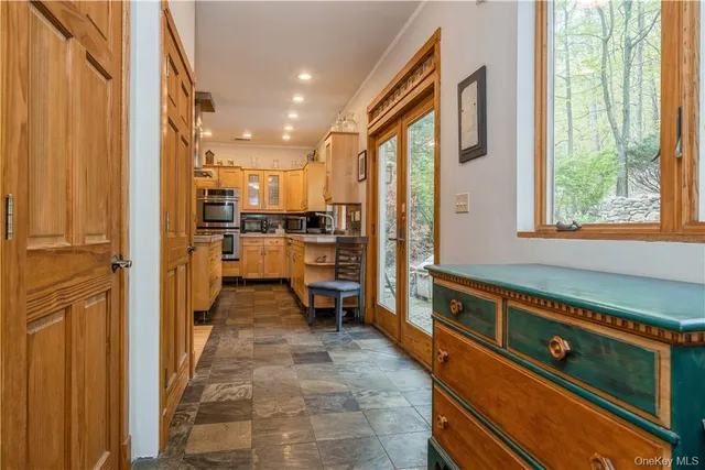 a view of a kitchen with a stove and cabinets