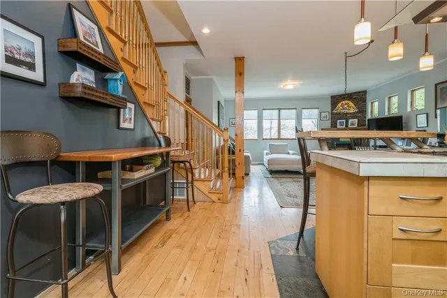 a kitchen with stainless steel appliances granite countertop a stove and a refrigerator