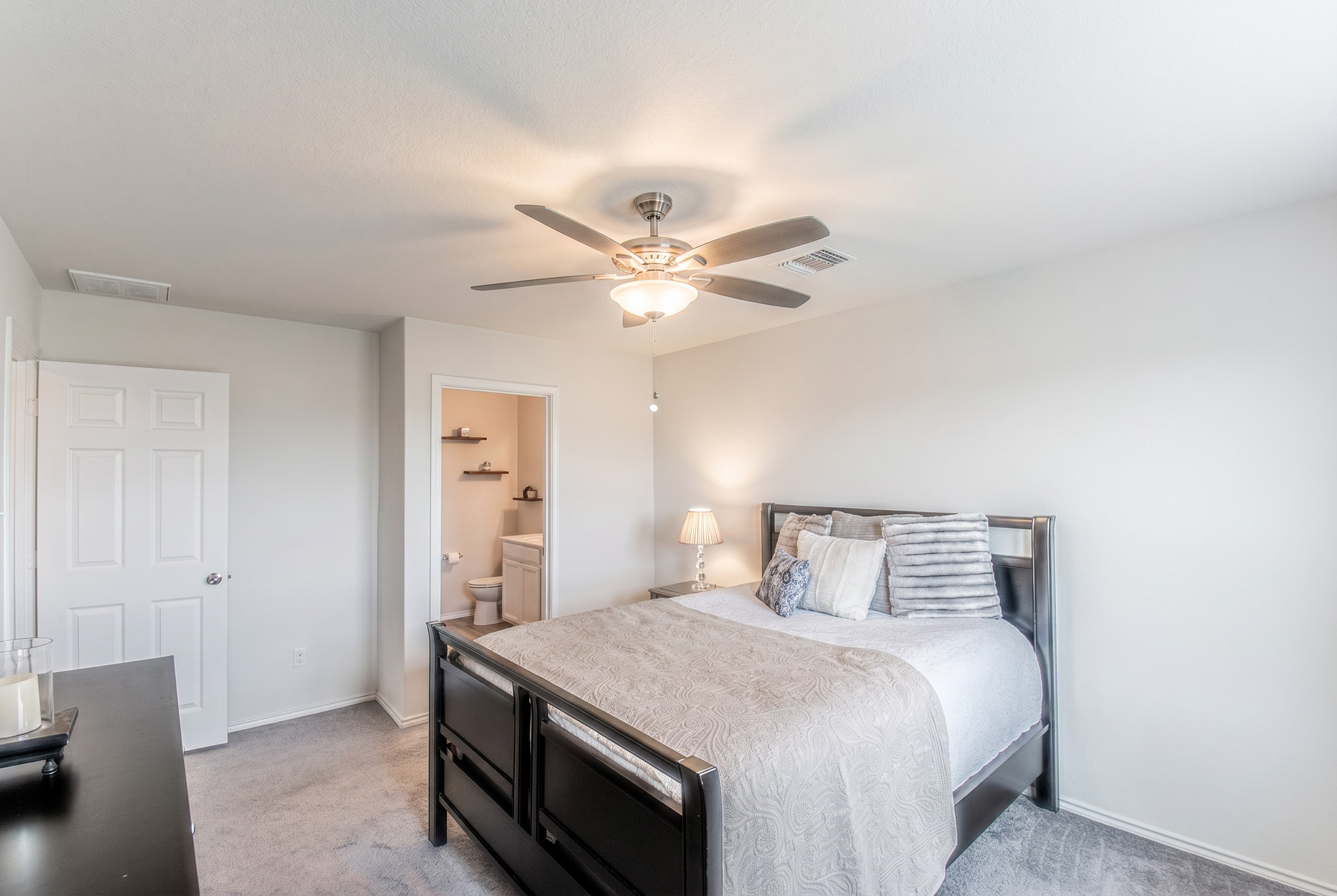192 Spotted Rail Ridge Leander, TX 78641 - Photo 14 of 34 a bedroom with a bed and a ceiling fan