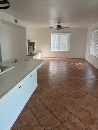 a view of a kitchen sink and dishwasher with wooden floor