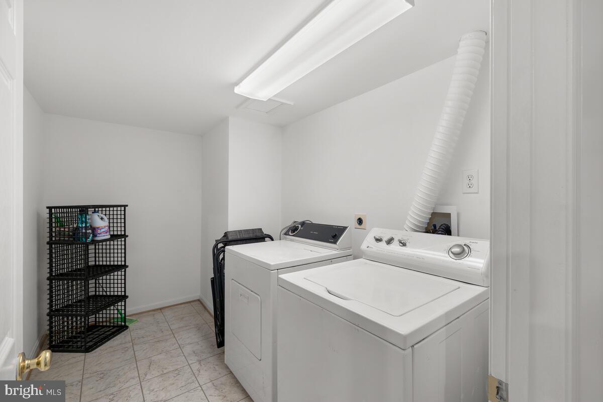 2395 Sunset Farm Road Ellicott City, MD 21042 - Photo 56 of 73 a utility room with dryer and washer