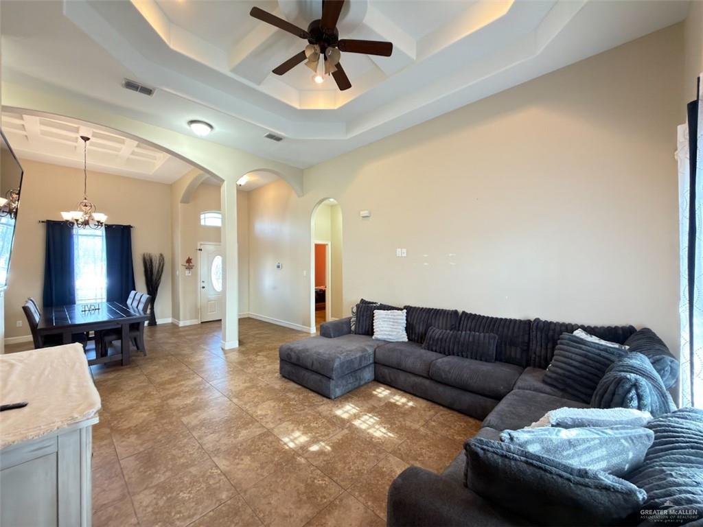 208 North 15th Street Hidalgo, TX 78557 - Photo 17 of 26 a living room with furniture and a flat screen tv