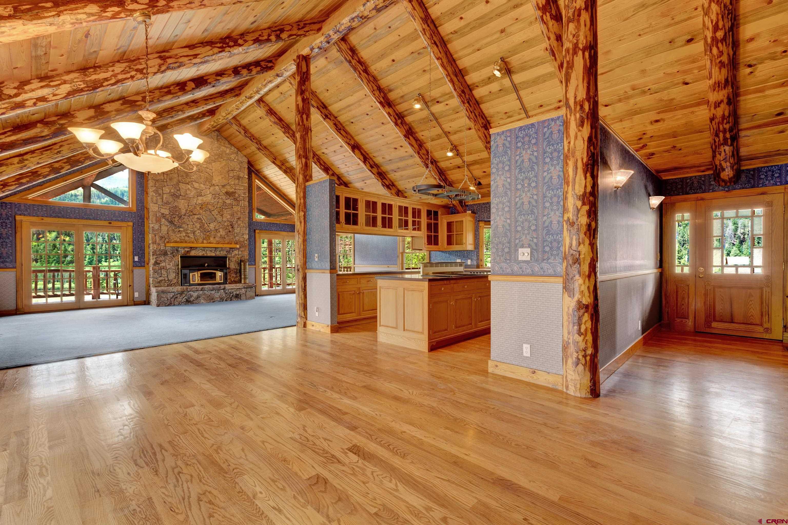 2692 County Road 17 Ridgway, CO 81432 - Photo 6 of 38 a view of living room kitchen with furniture and wooden floor