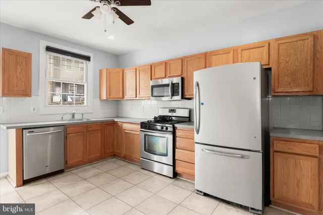 a white refrigerator freezer sitting in a kitchen