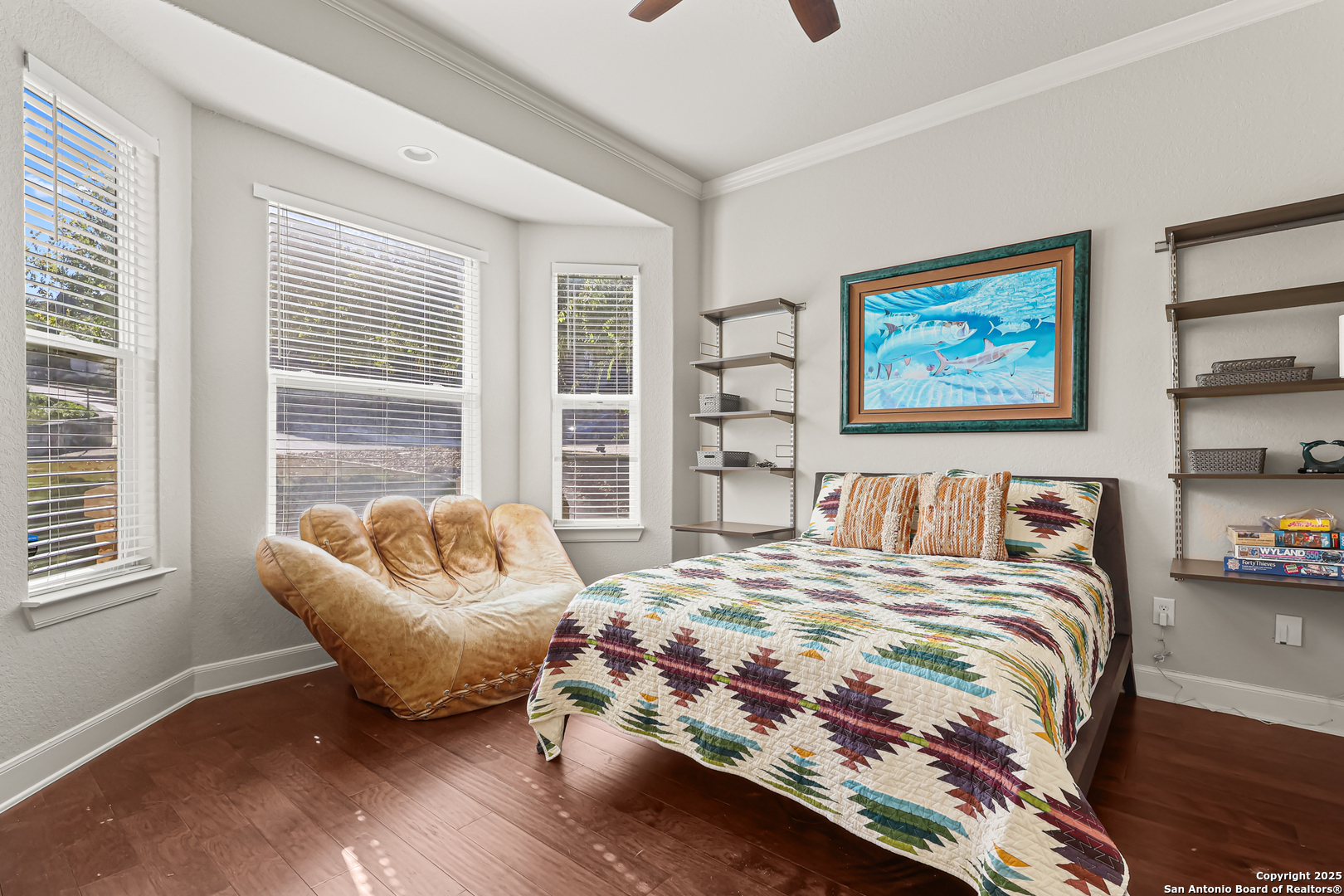 919 Sutters Rim San Antonio, TX 78258 - Photo 18 of 27 a bedroom with a bed and a couch